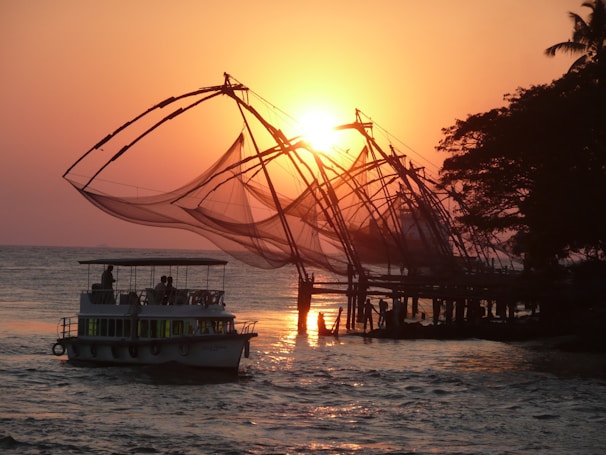 Sunset over the ocean with a Pescanova ship returning after a day of responsible fishing.