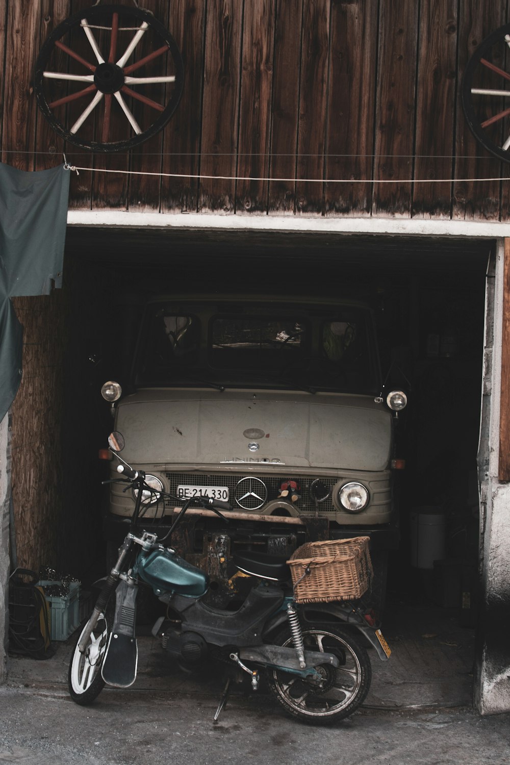 black motorcycle beside white car