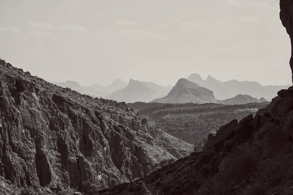 rocky mountain under cloudy sky