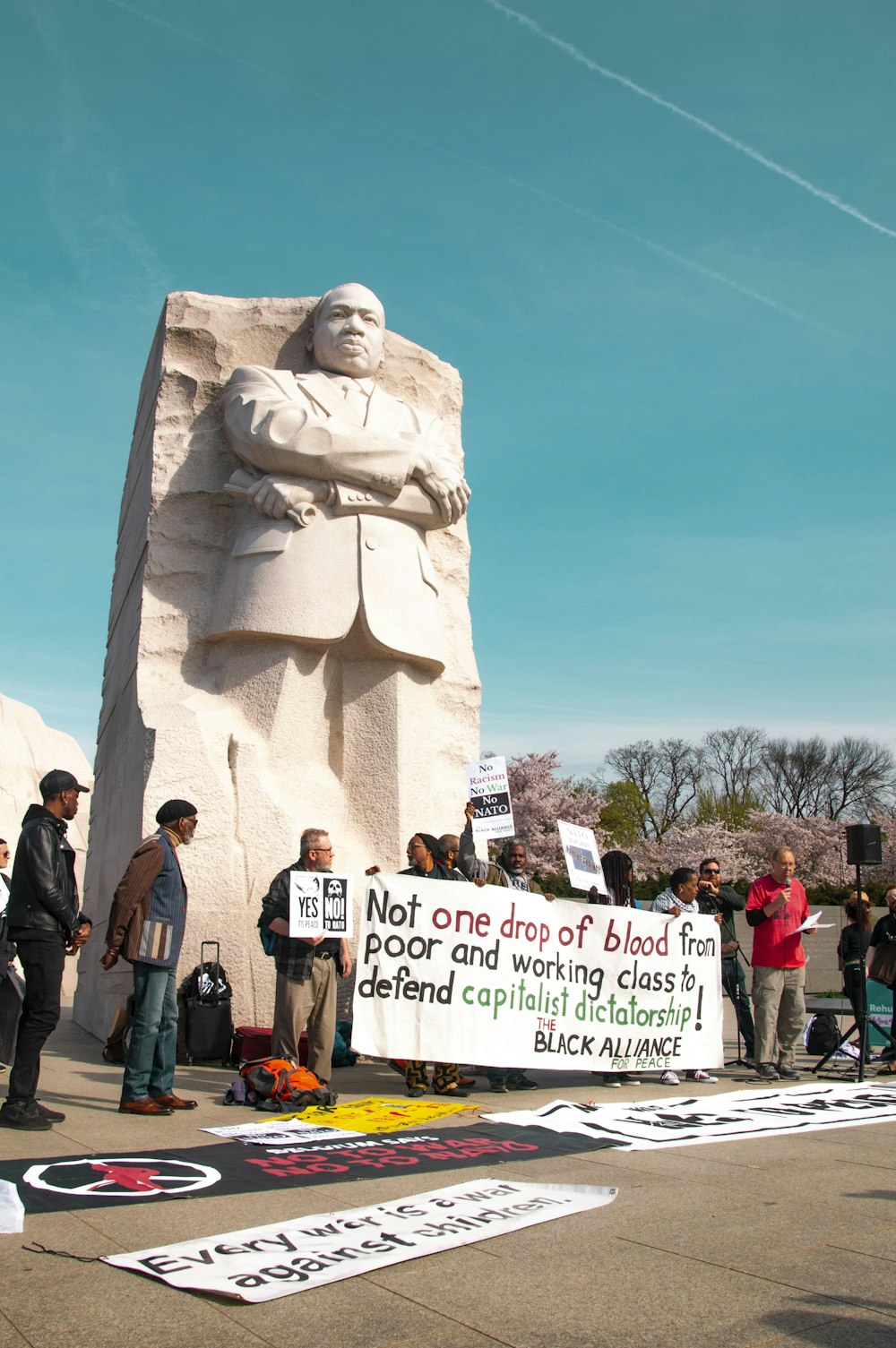 people standing beside statue