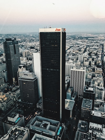 Legal team discussing case files in Karachi branch with city skyline visible.