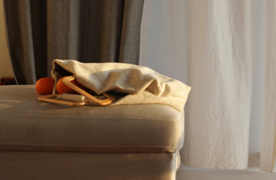 Close-up of a plush bean bag showcasing its soft cotton blend texture in a cozy indoor lounge.