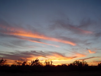 A vibrant sunset over a serene landscape, capturing the beauty of nature's colors.