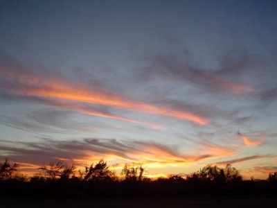 A serene landscape at sunset with vibrant colors.