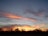 A serene landscape with a peaceful sunset, symbolizing hope.