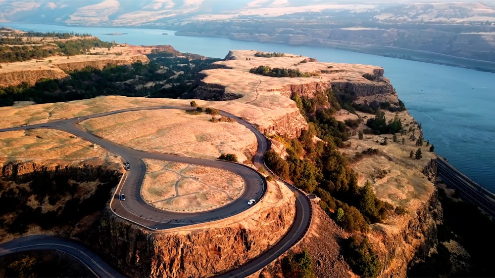 winding blacktop on top of rock hill overlooking sea