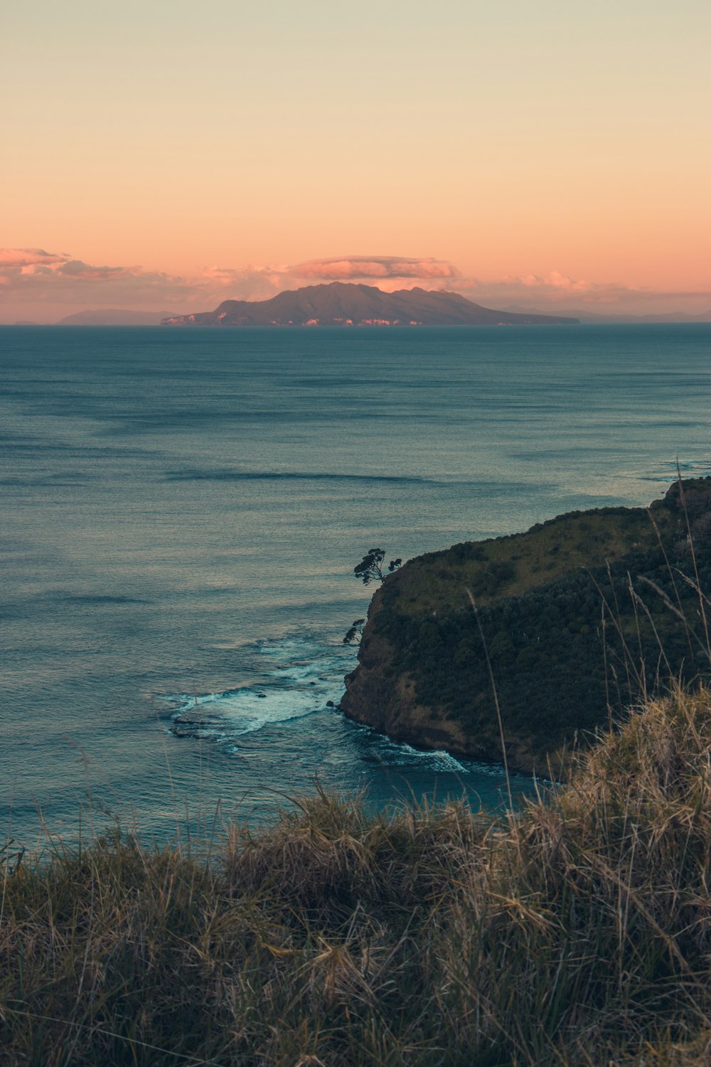 orange sky over blue sea