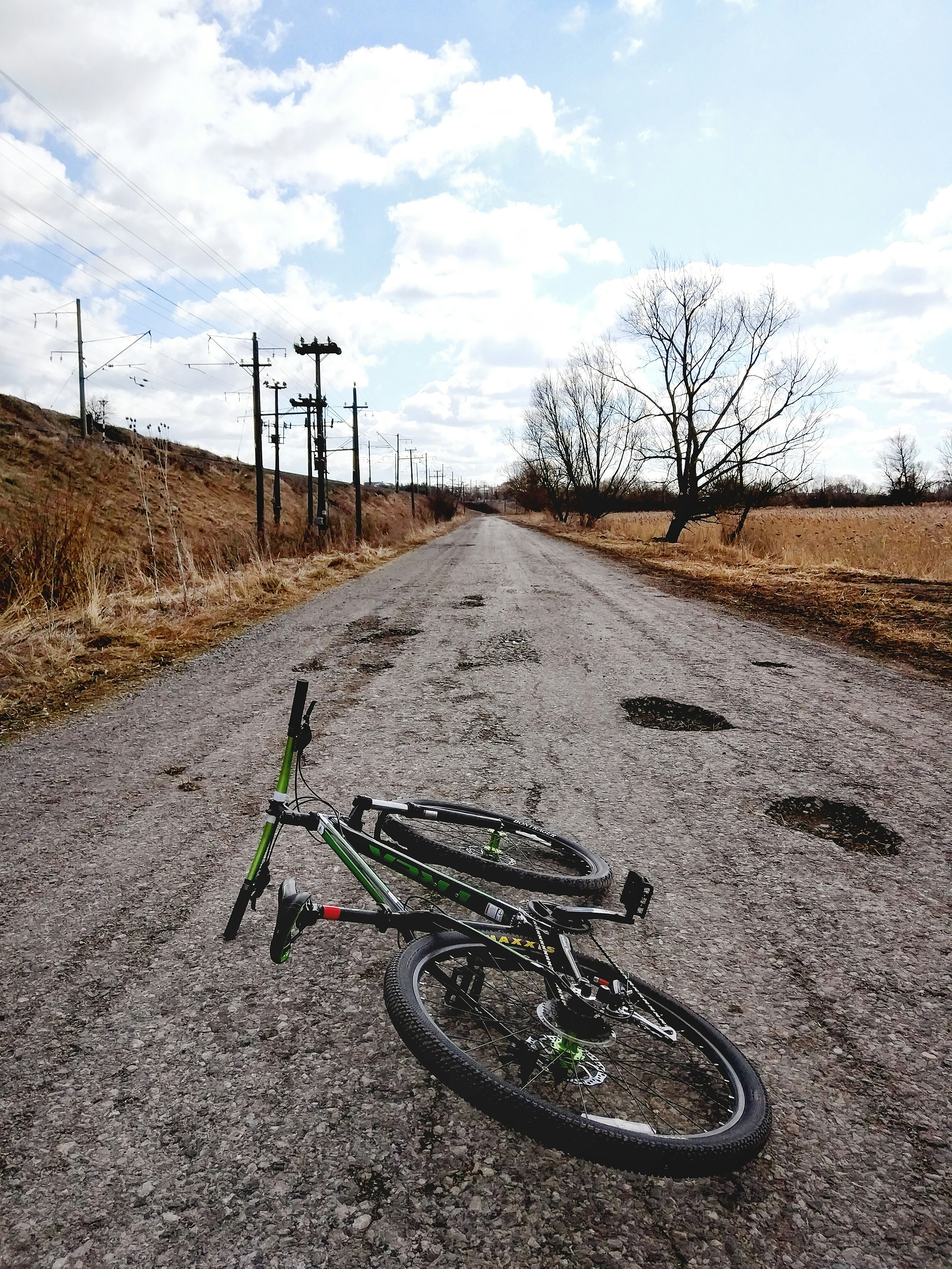 green and black bicycle on trail