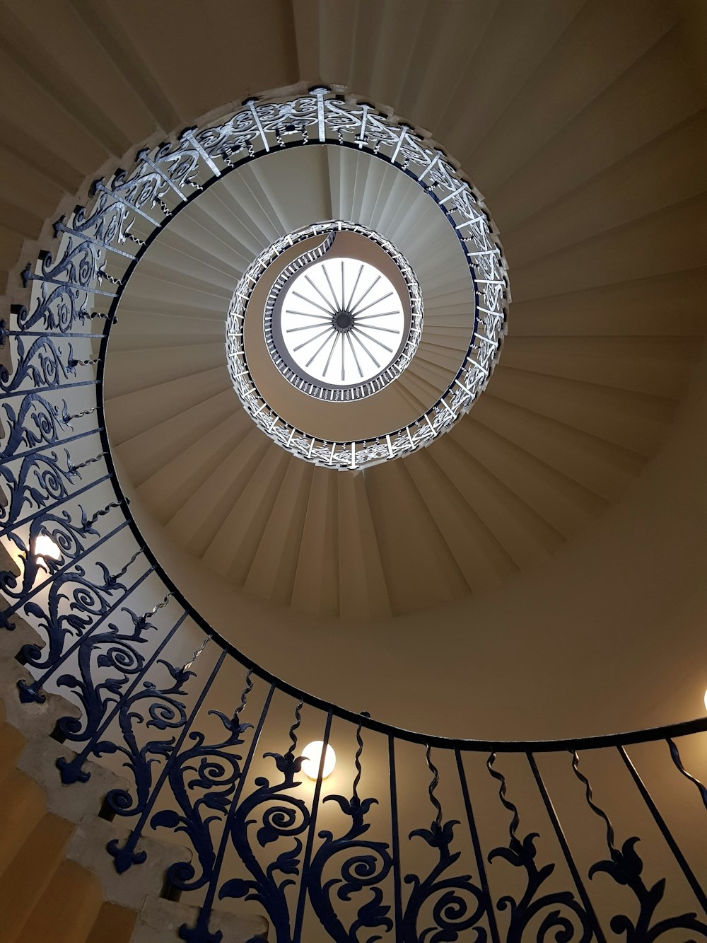 low angle photography of spiral stairs