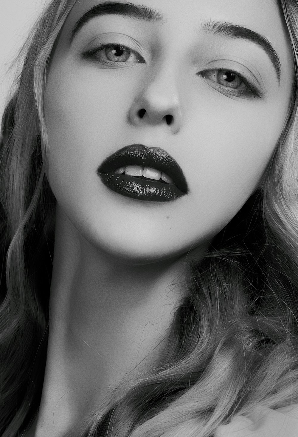 grayscale photo of woman with lipstickl