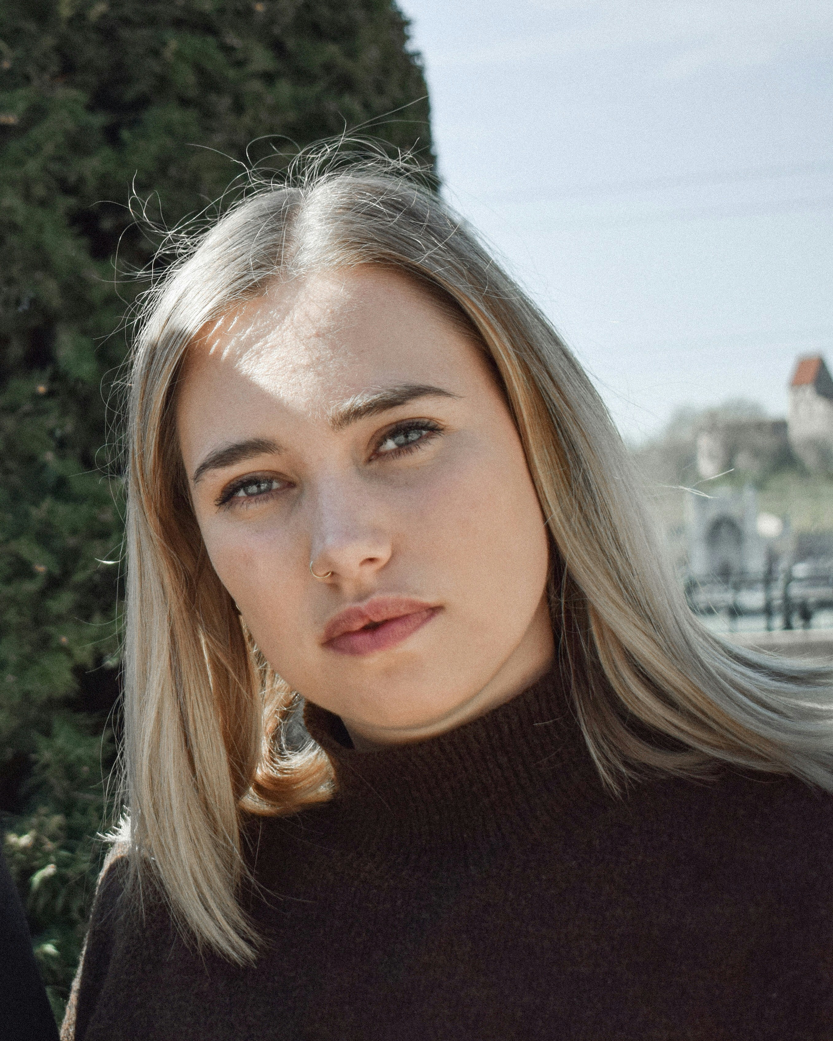 shallow focus photo of woman in black turtleneck shirt