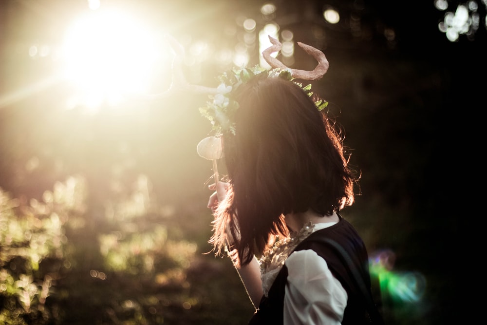 a woman with a flower crown on her head