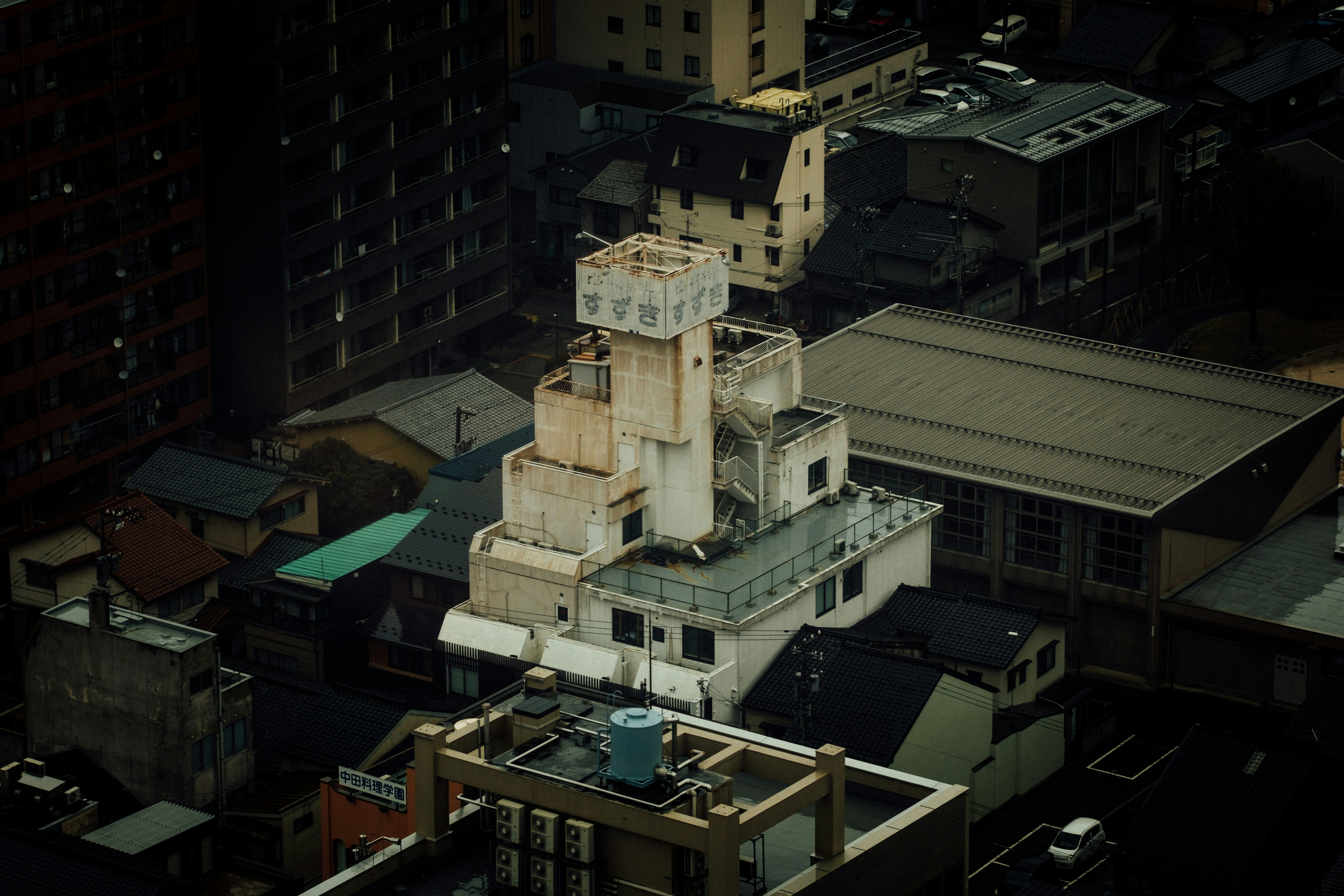 Fujifilm X-T2 + Fujifilm XF 90mm F2 R LM WR sample photo. White painted building aeria photography