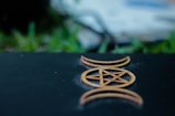 A jagged pentagram etched in dark stone with faint red glowing edges.