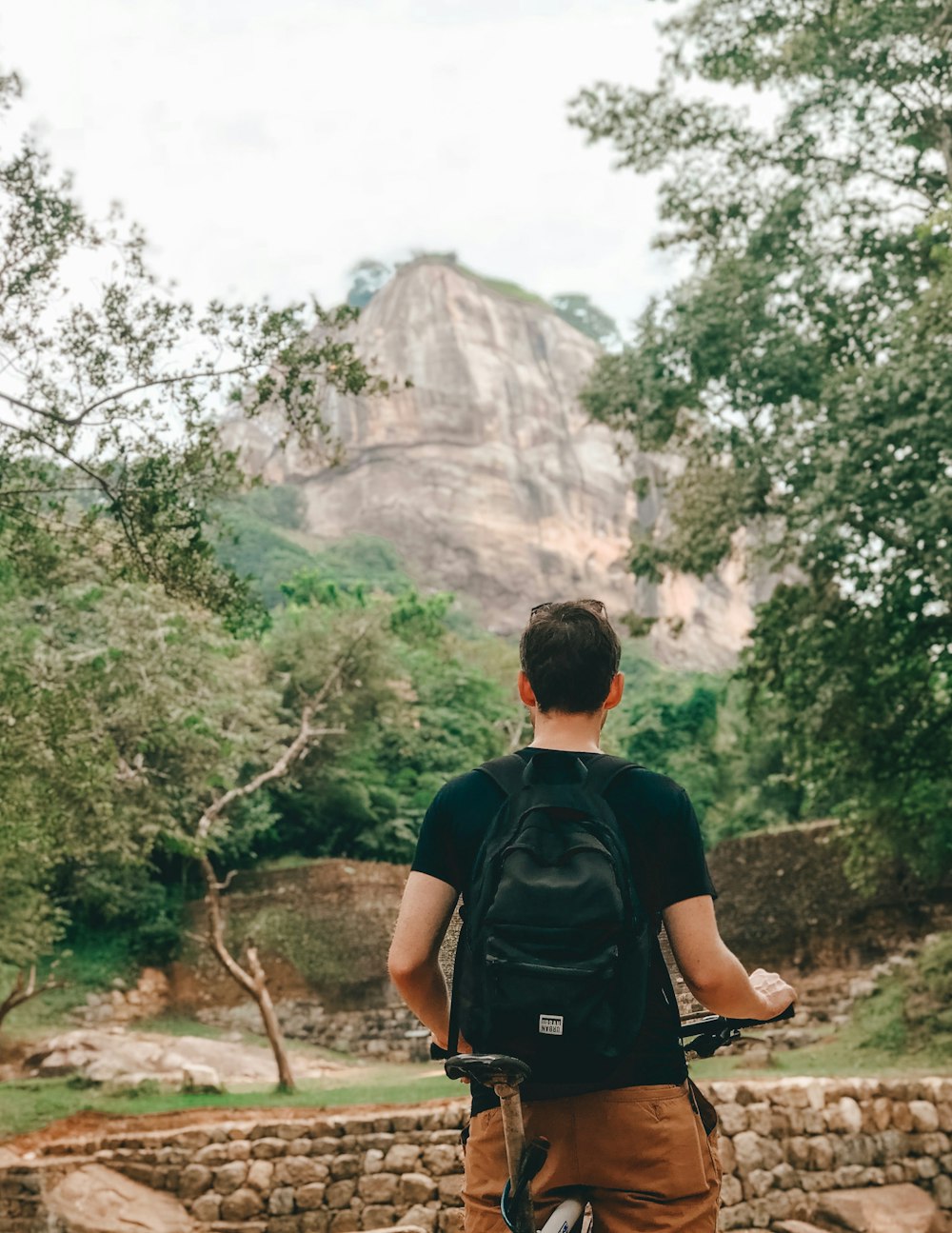 man standing near mountain