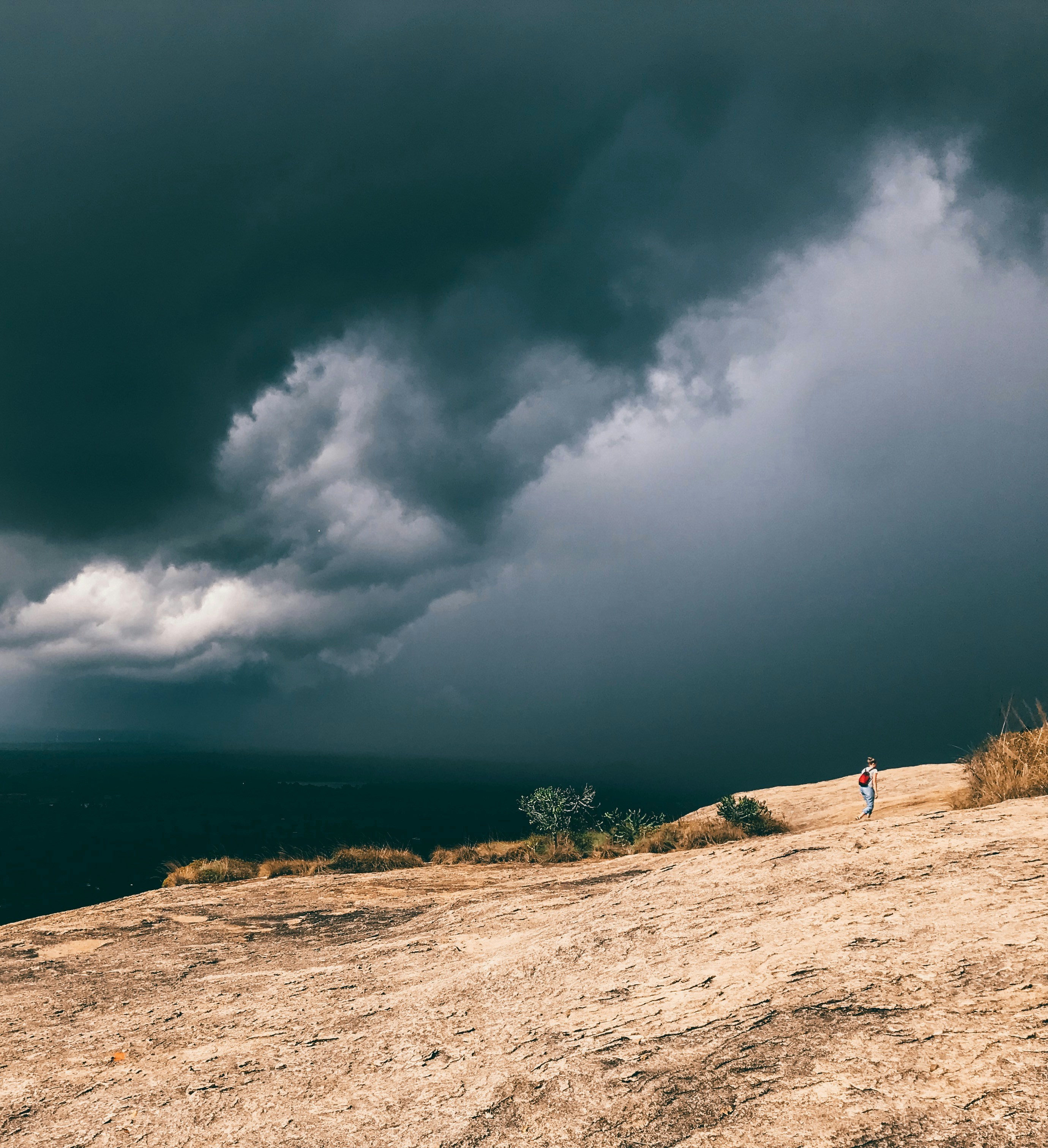 person standing under blue skies