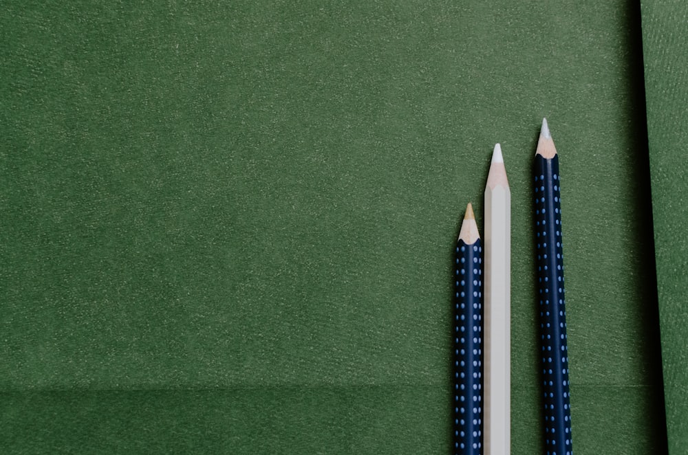 white and blue pencils