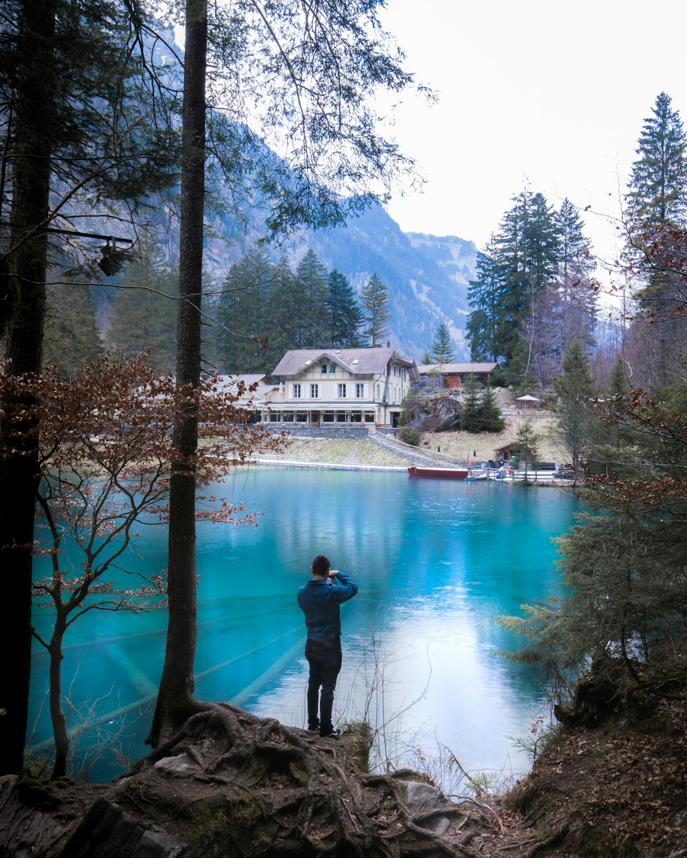 man standing near body of water