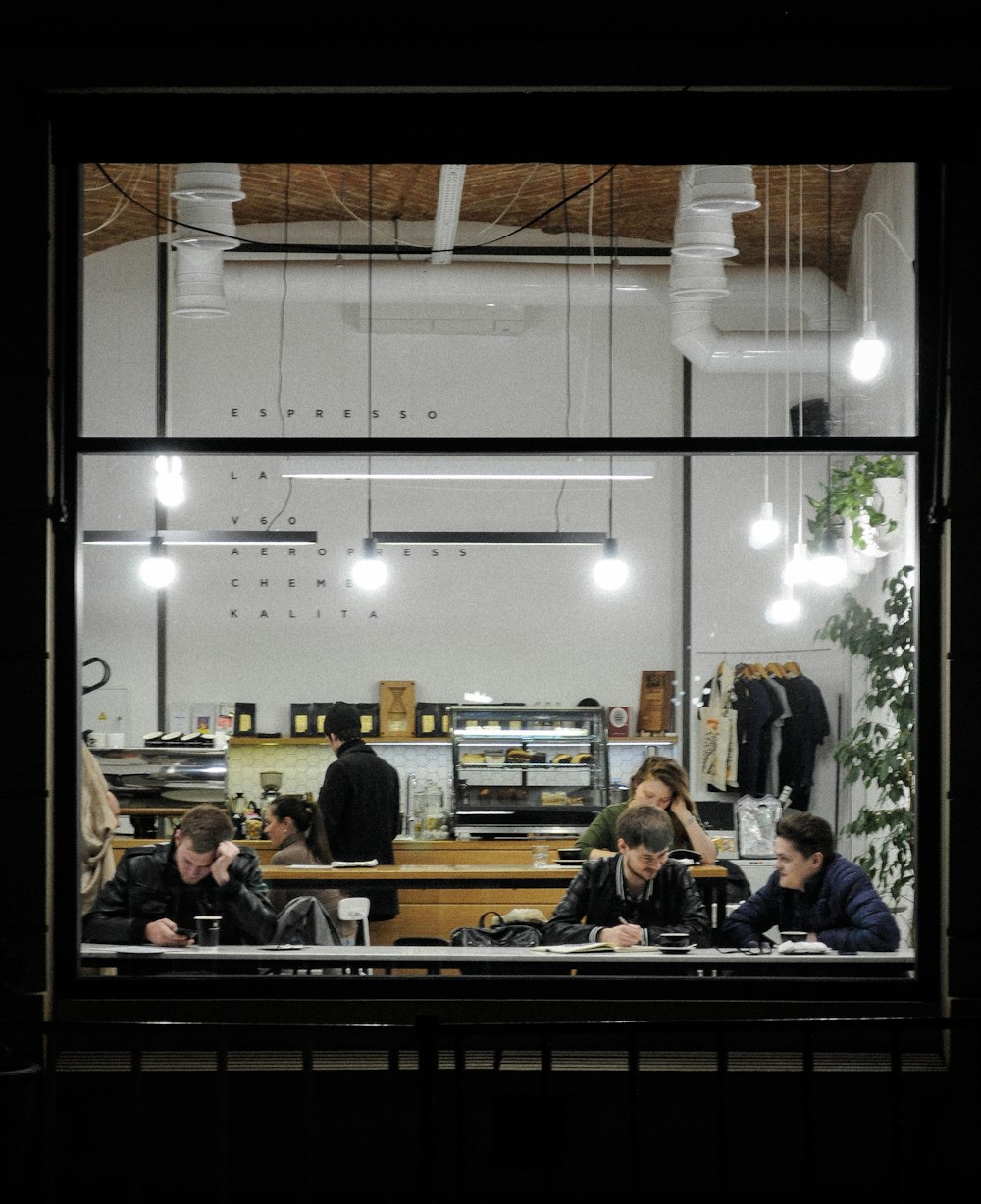 group of people sitting inside the room