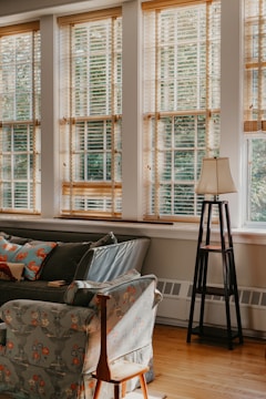 Cozy room with stylish blinds and polished laminate floors.