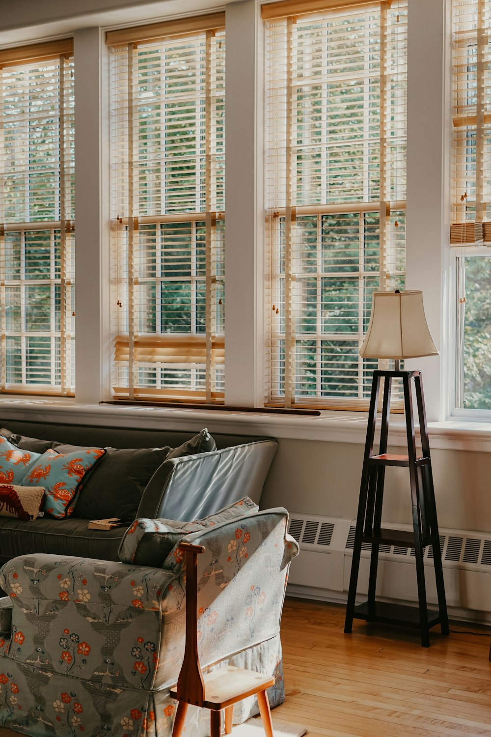 black and white floor lamp near white and brown wooden window frames