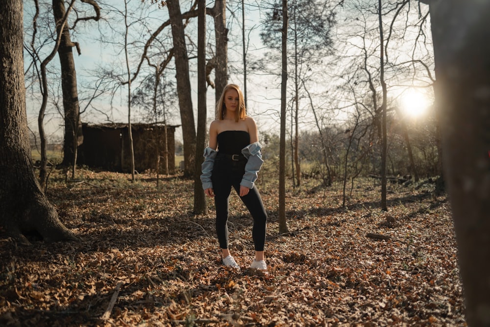 woman standing on forest