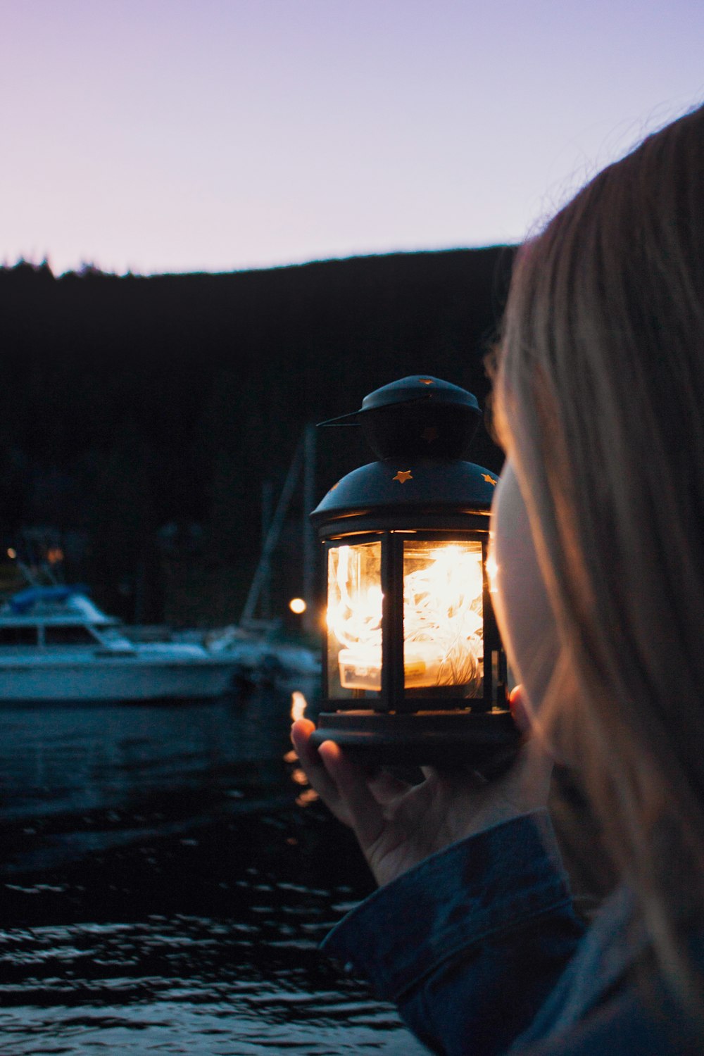 girl holding lamp