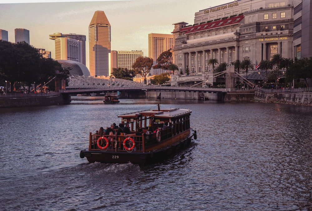 black and brown boat on river during golden hour