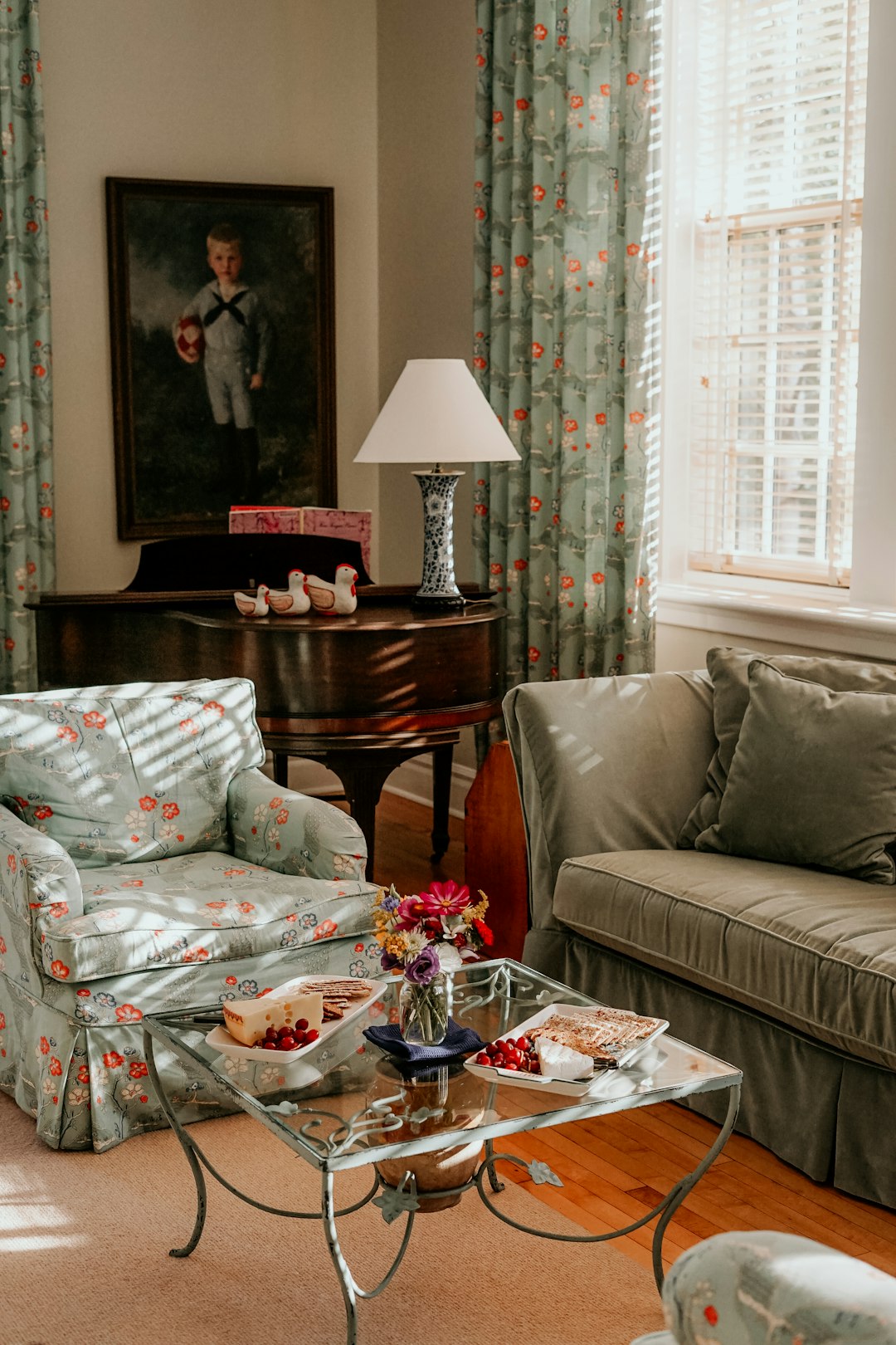 green couch and blue floral armchair