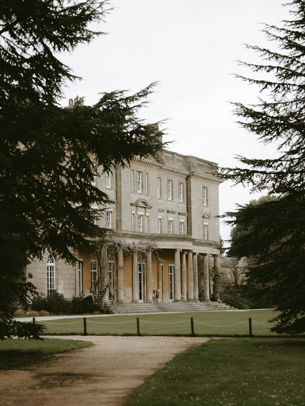 a large building with a long driveway in front of it