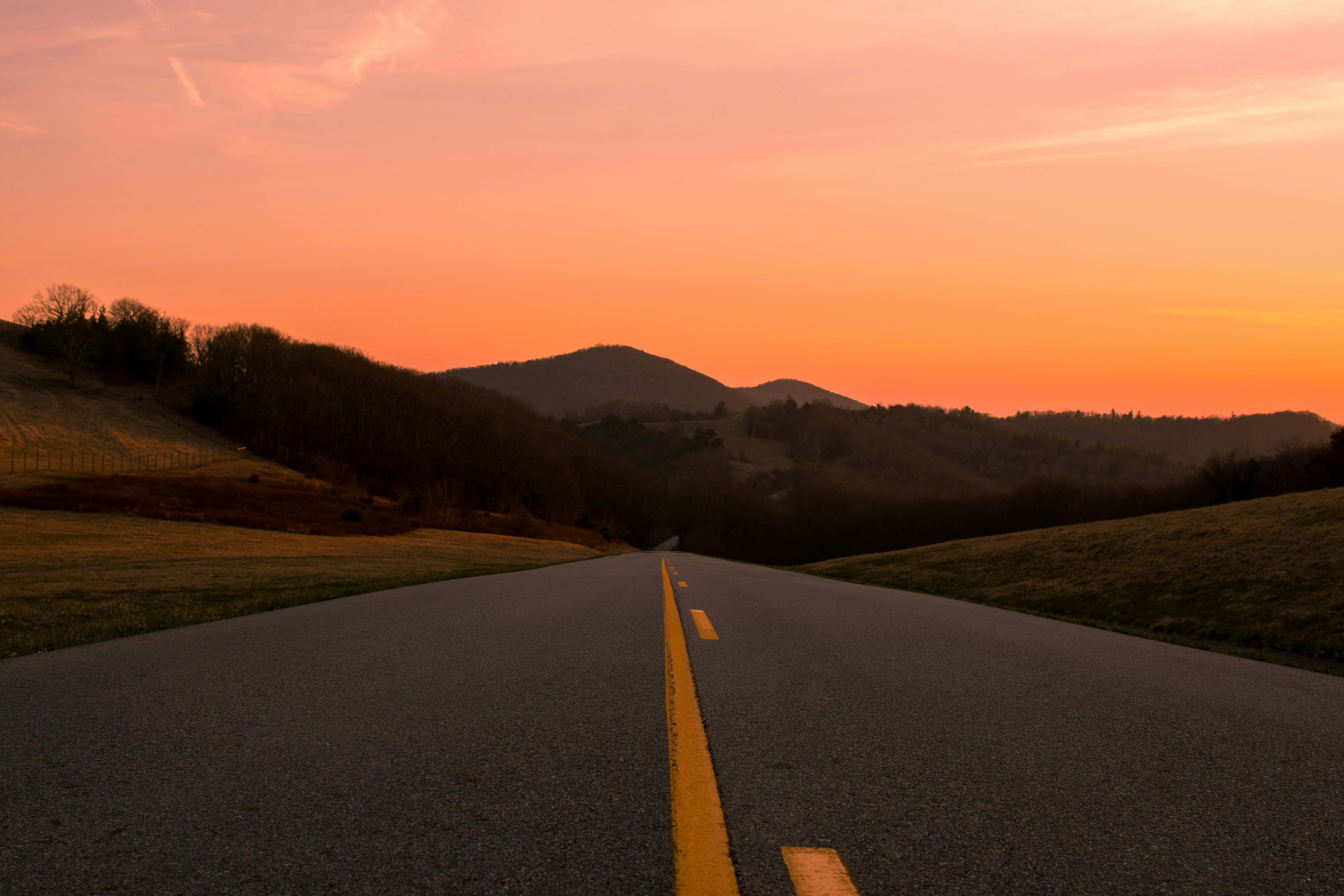 road near mountain during daytime