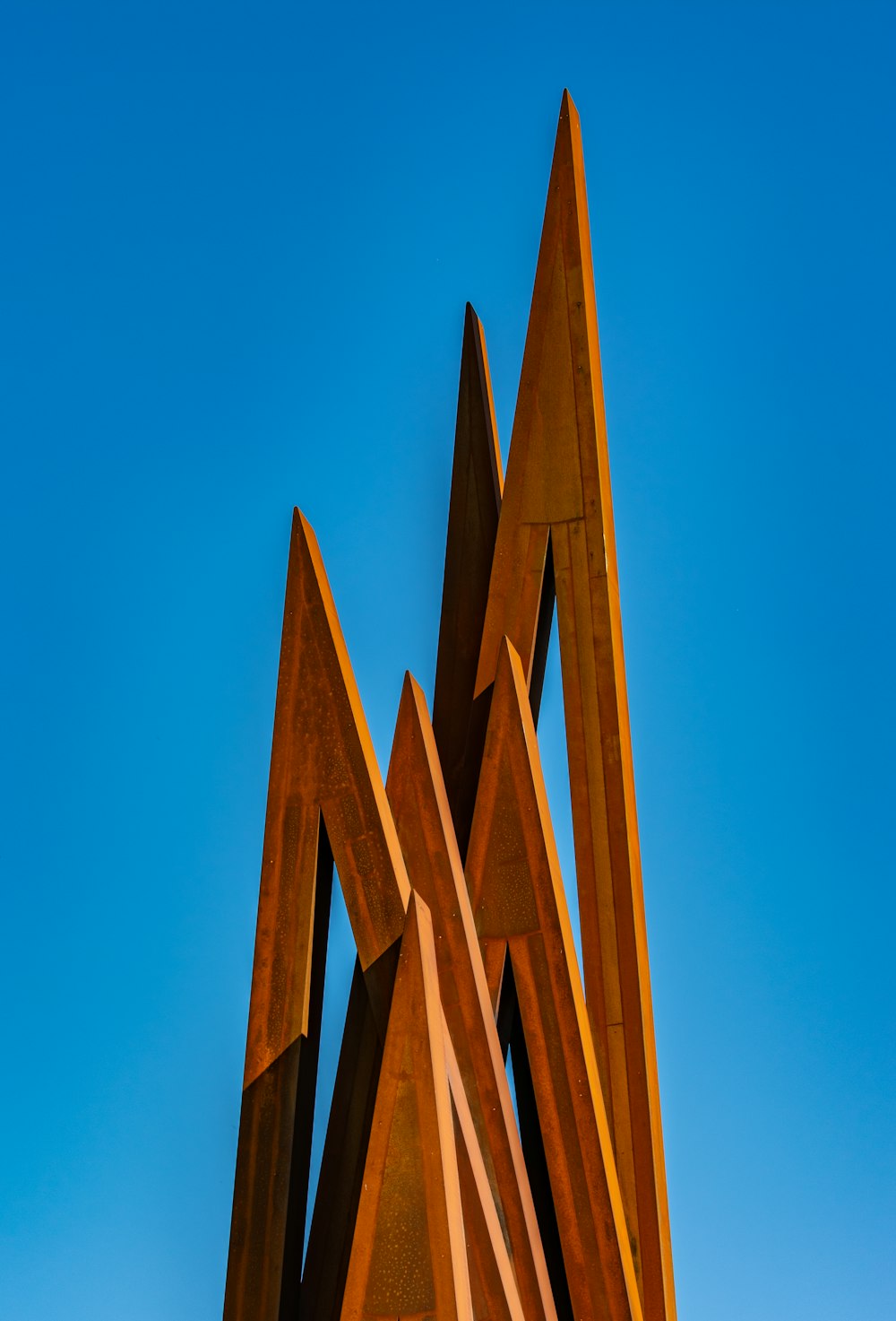 wooden brown triangular tool