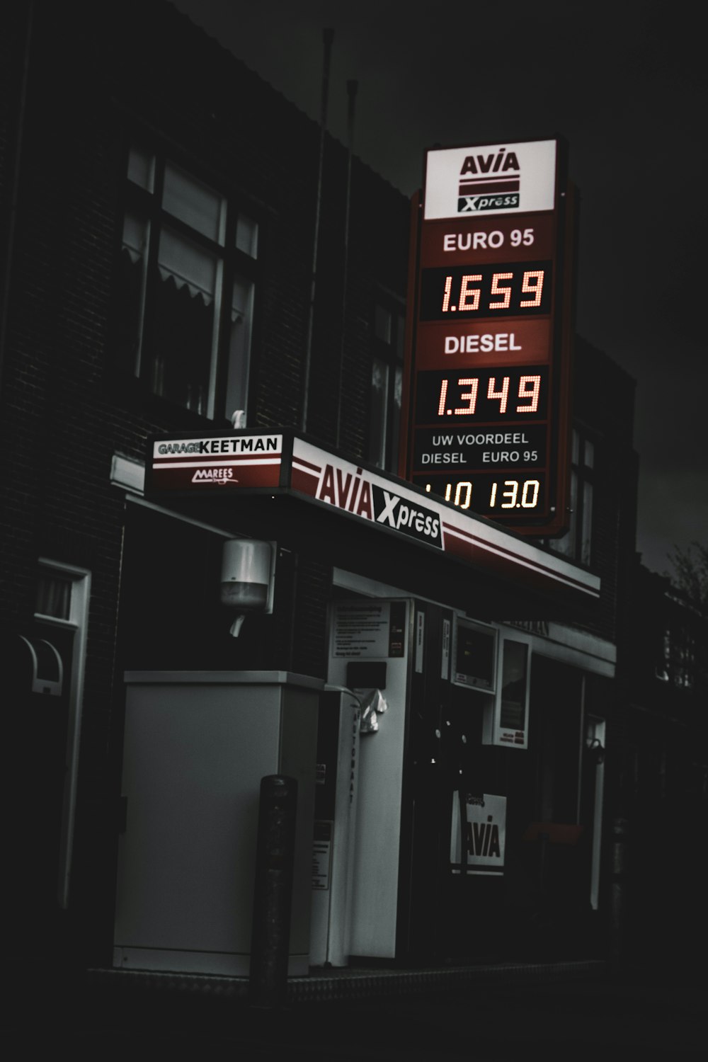 selective color photography of Avia diesel signage