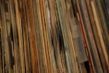 Close-up of colorful vinyl sheets stacked neatly.