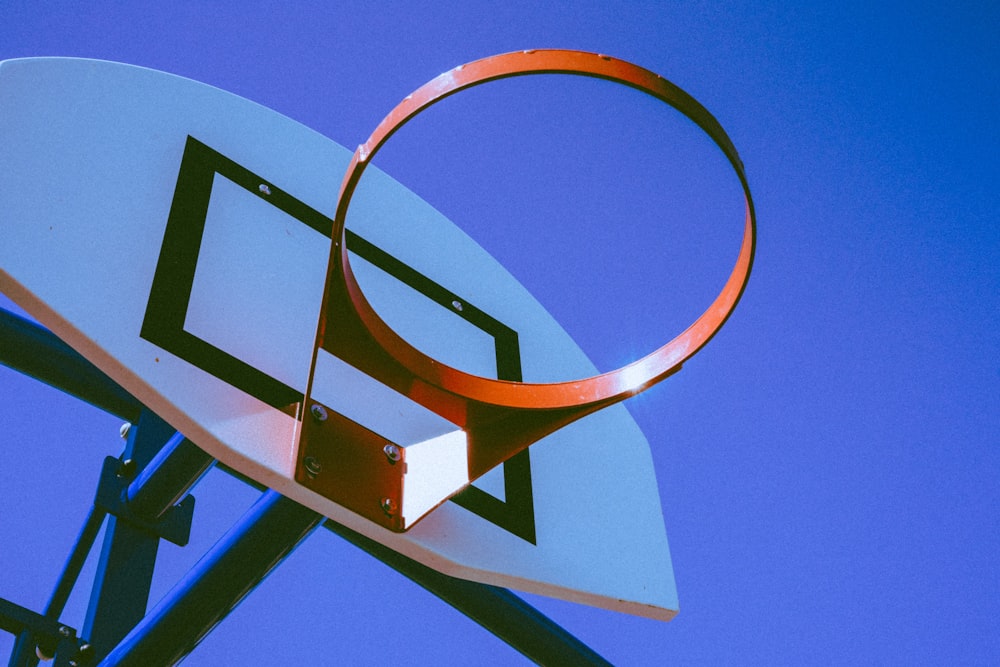 low-angle photography of basketball hoop during daytime