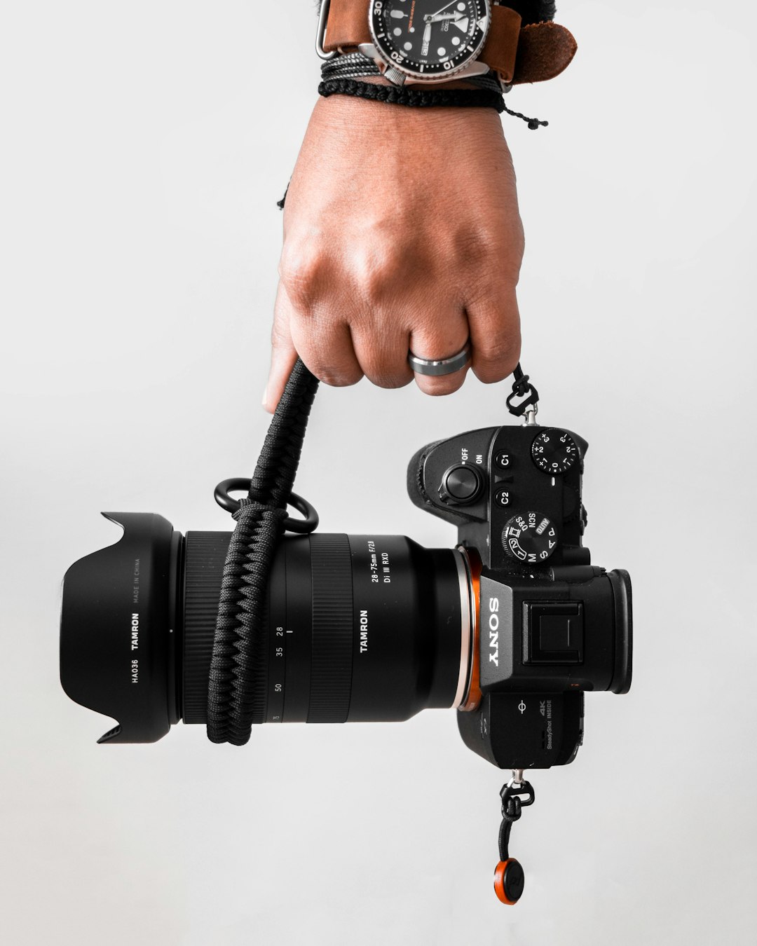 person holding black Sony DSLR camera