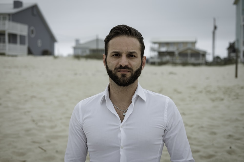 man standing on white sand