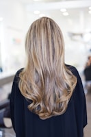 Close-up of a vibrant balayage hairstyle with soft waves.
