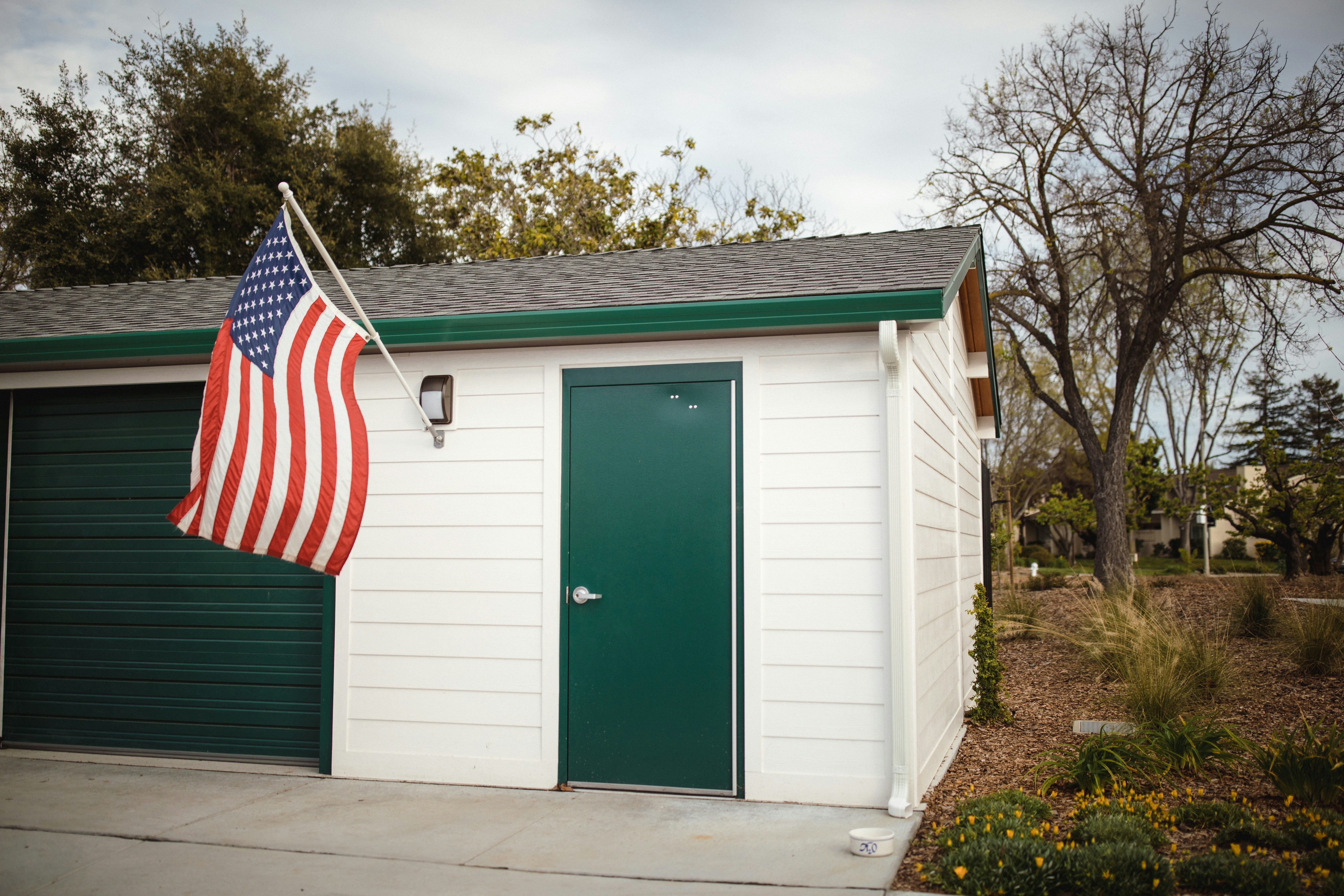 Family charging a new electric SUV at a home garage charger