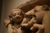 A close-up of a detailed stone sculpture showcasing intricate textures and craftsmanship.