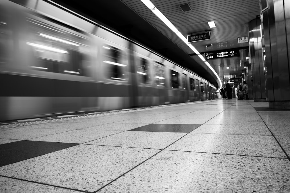 grayscale photography of train station