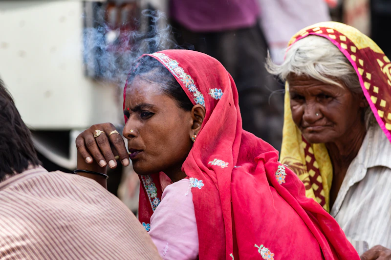 Sophisticated Indian sugar mama enjoying a smoke