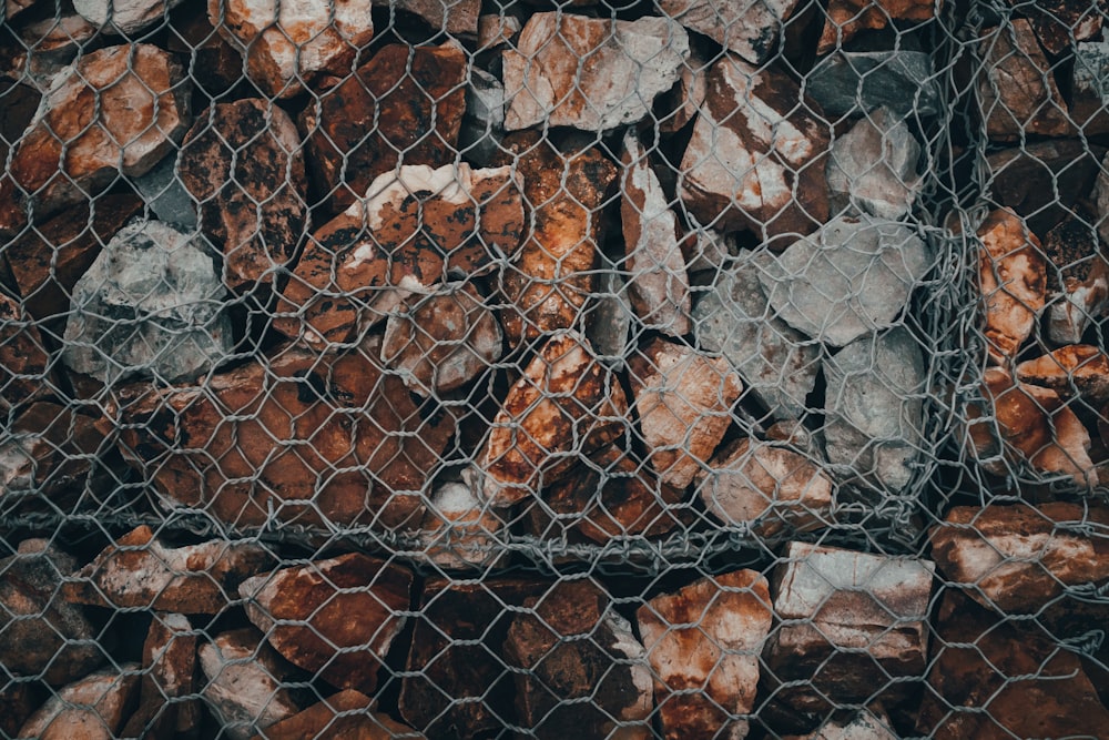 a pile of rocks sitting next to a net