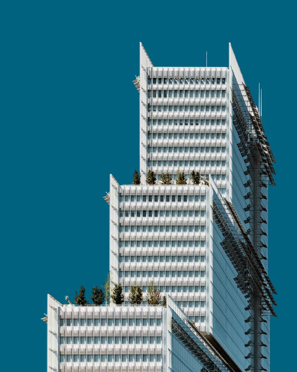 white 3-story high-rise building