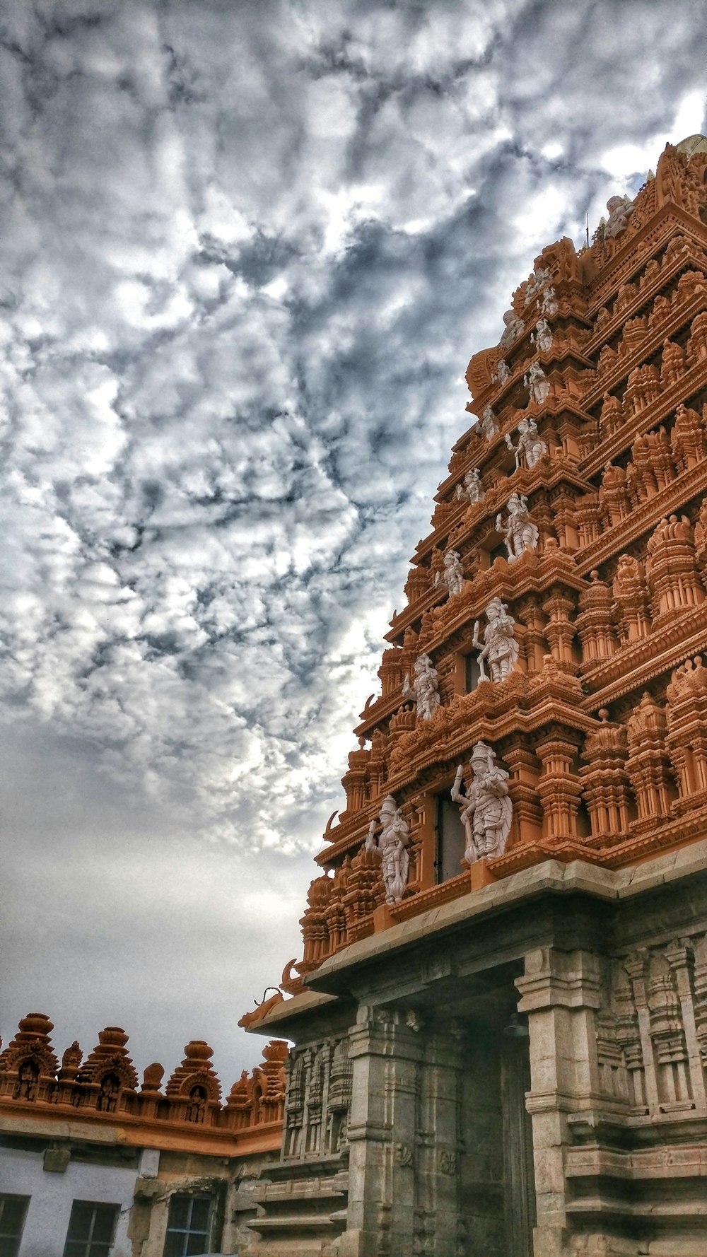 brown temple under cloudy sky