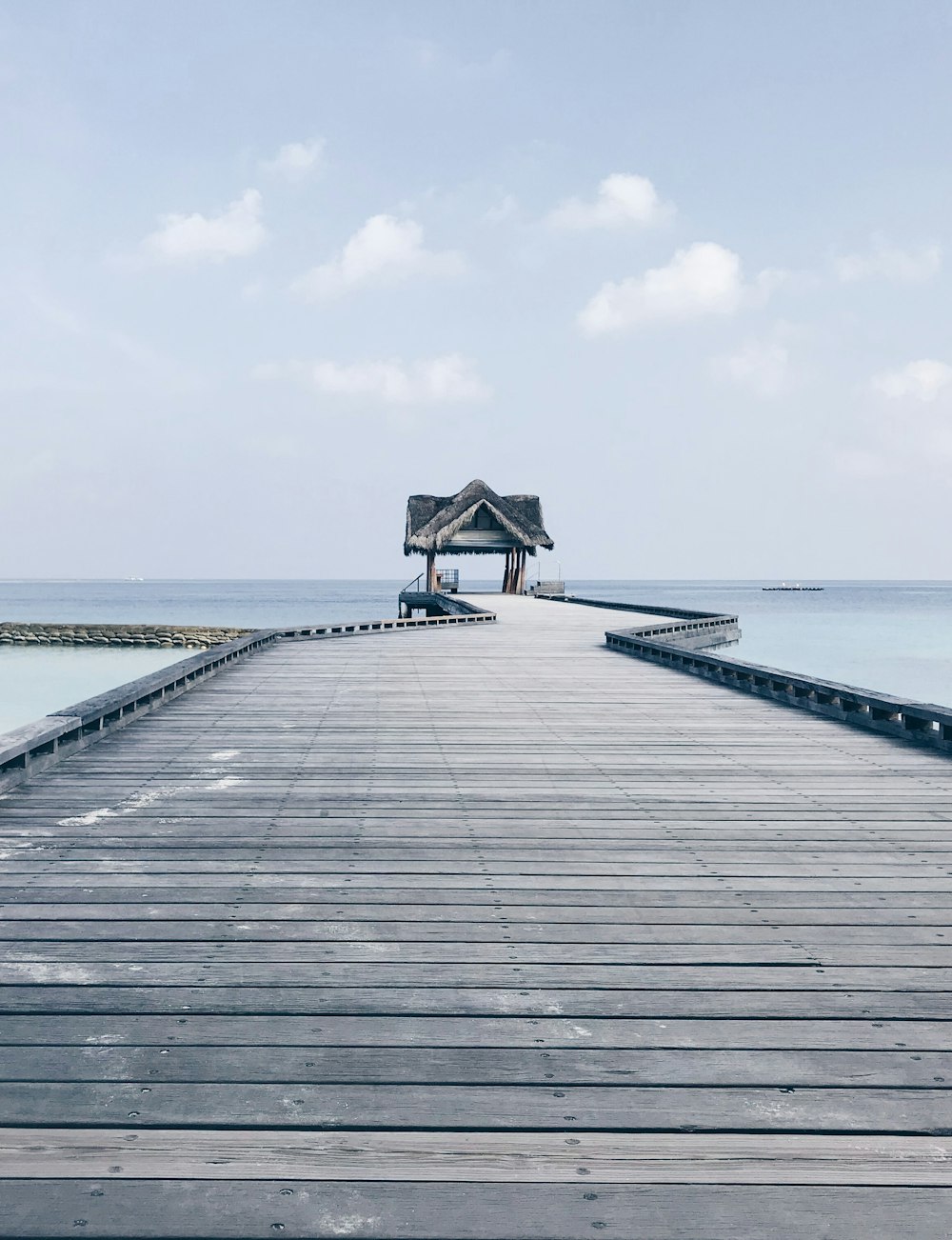 brown wooden dock under blue sky