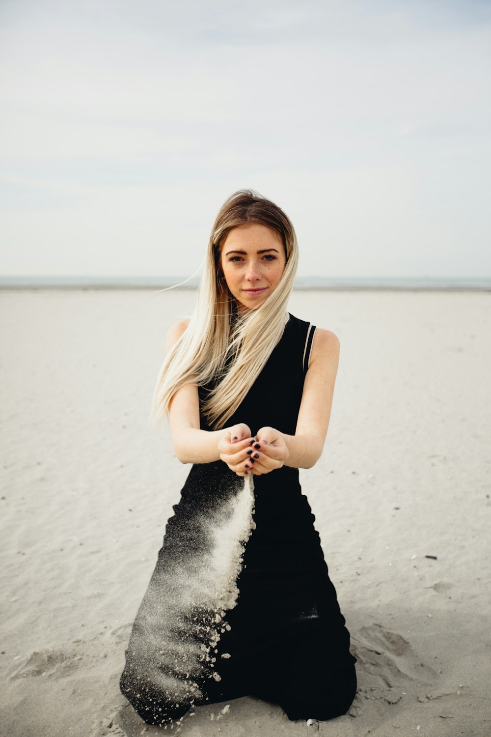 woman playing with sand