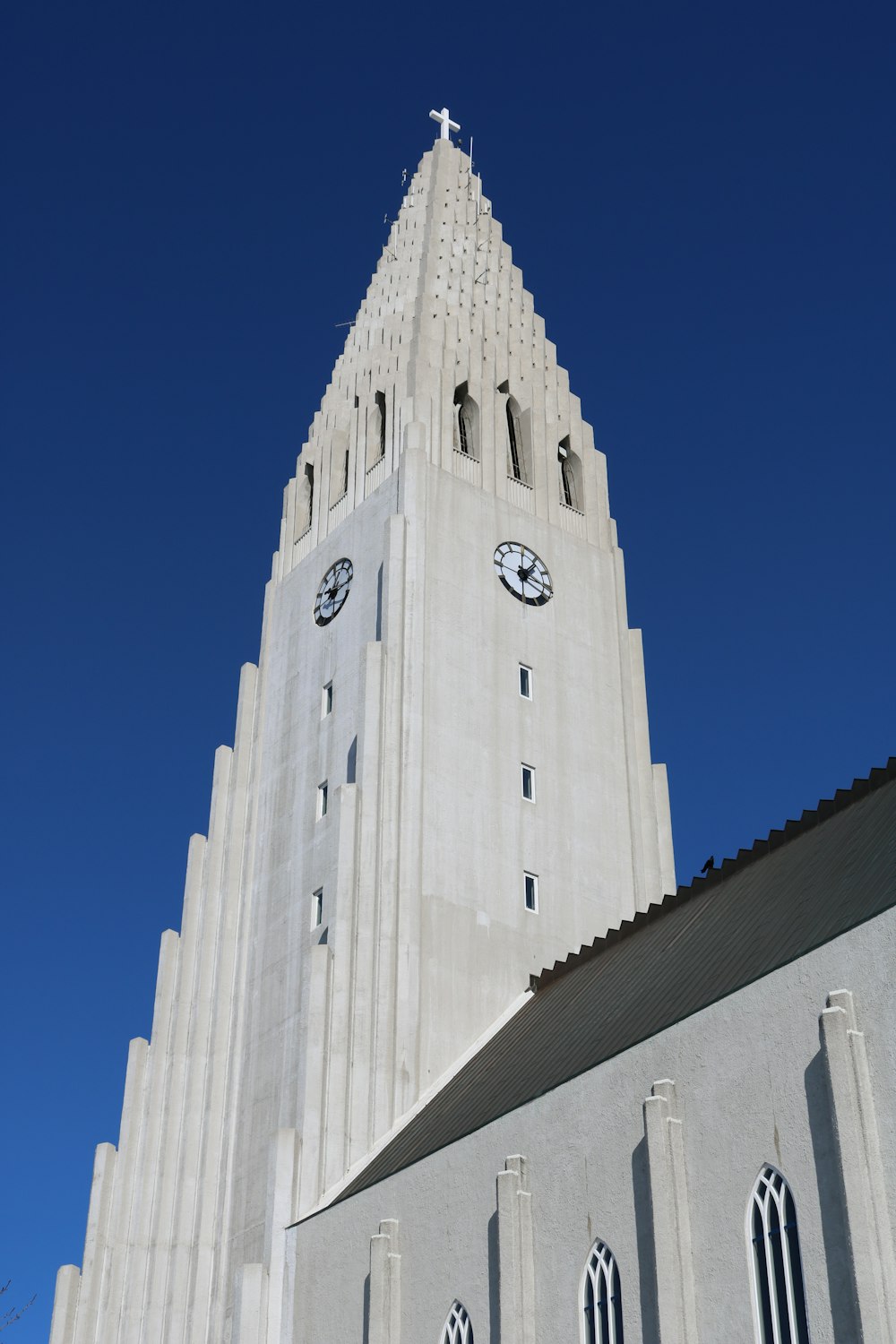 white and black concrete building under blue sky