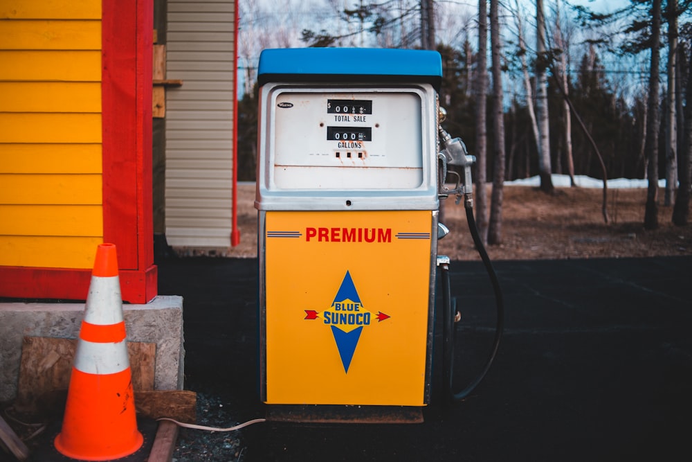 white and yellow Premium gasoline station