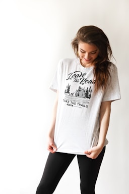 smiling woman in black and white print t-shirt